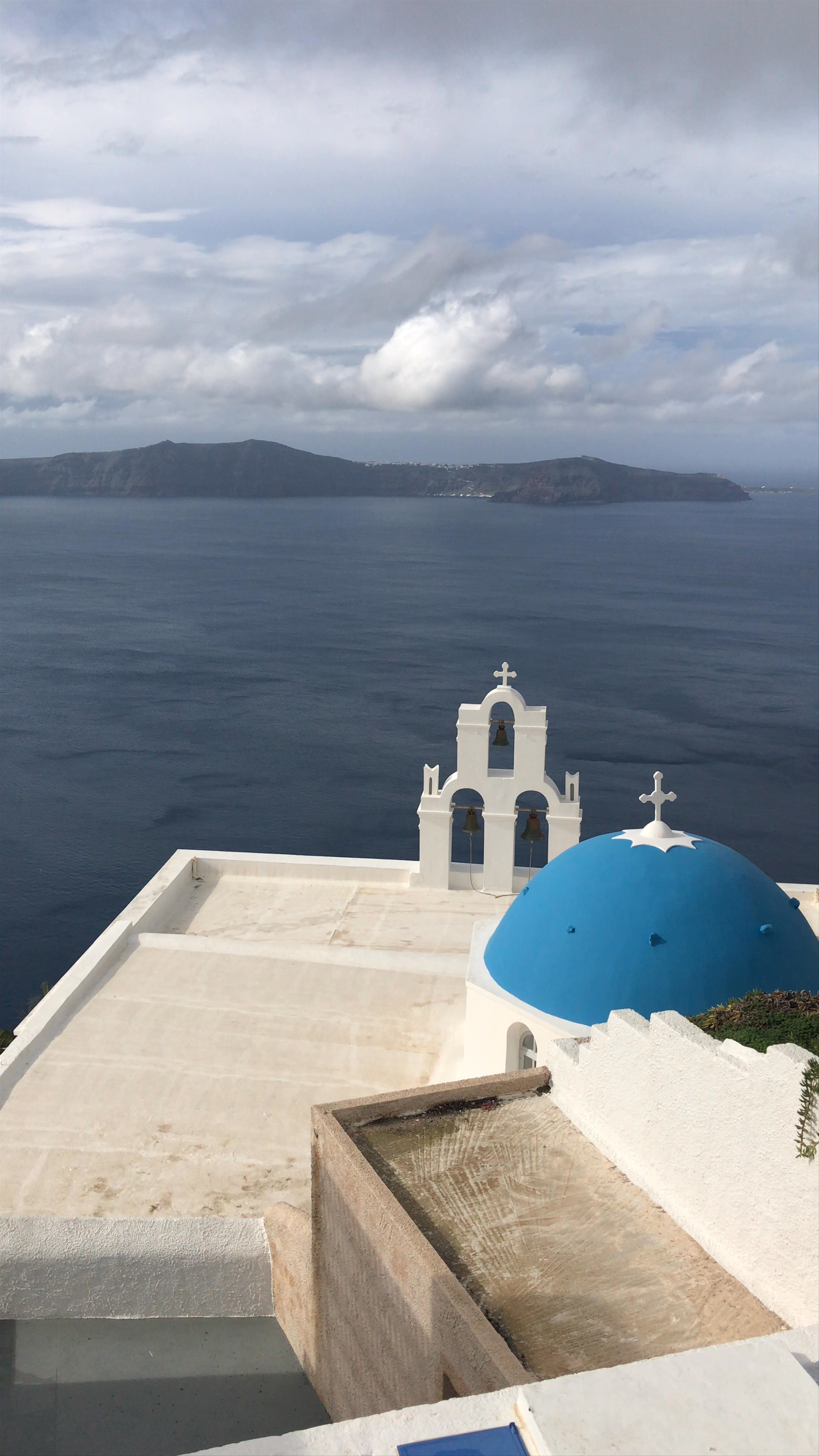 Enchanting Views of Santorini’s Iconic Blue Domes and Caldera