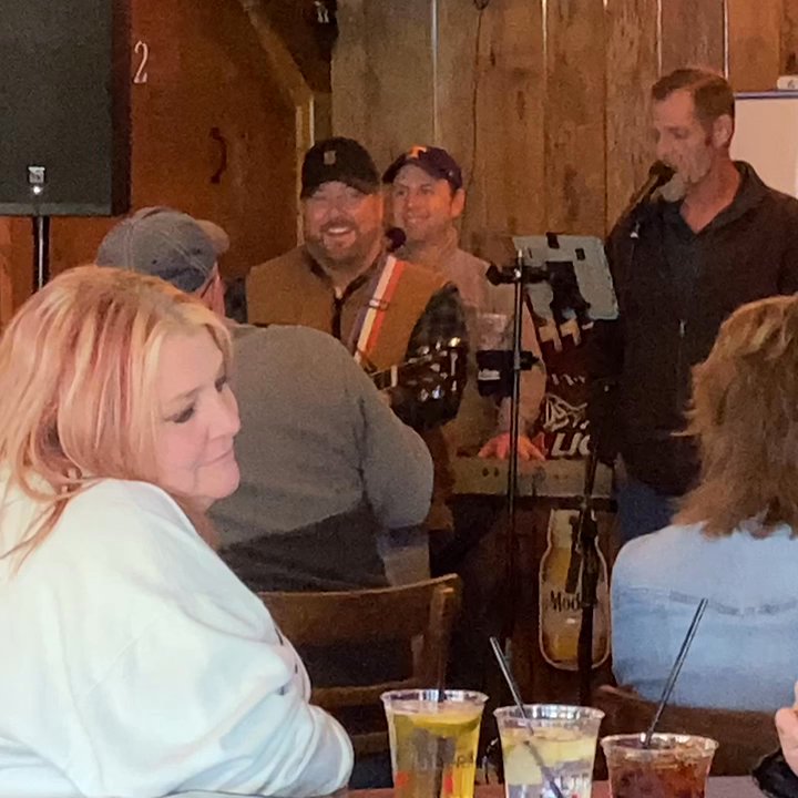 Iron Boar Saloon - Band singing Rocky Top. I don't know those people in front of me but it looked like they were having a good time. - Dive Bars Near Me - Pigeon Forge, Tennessee