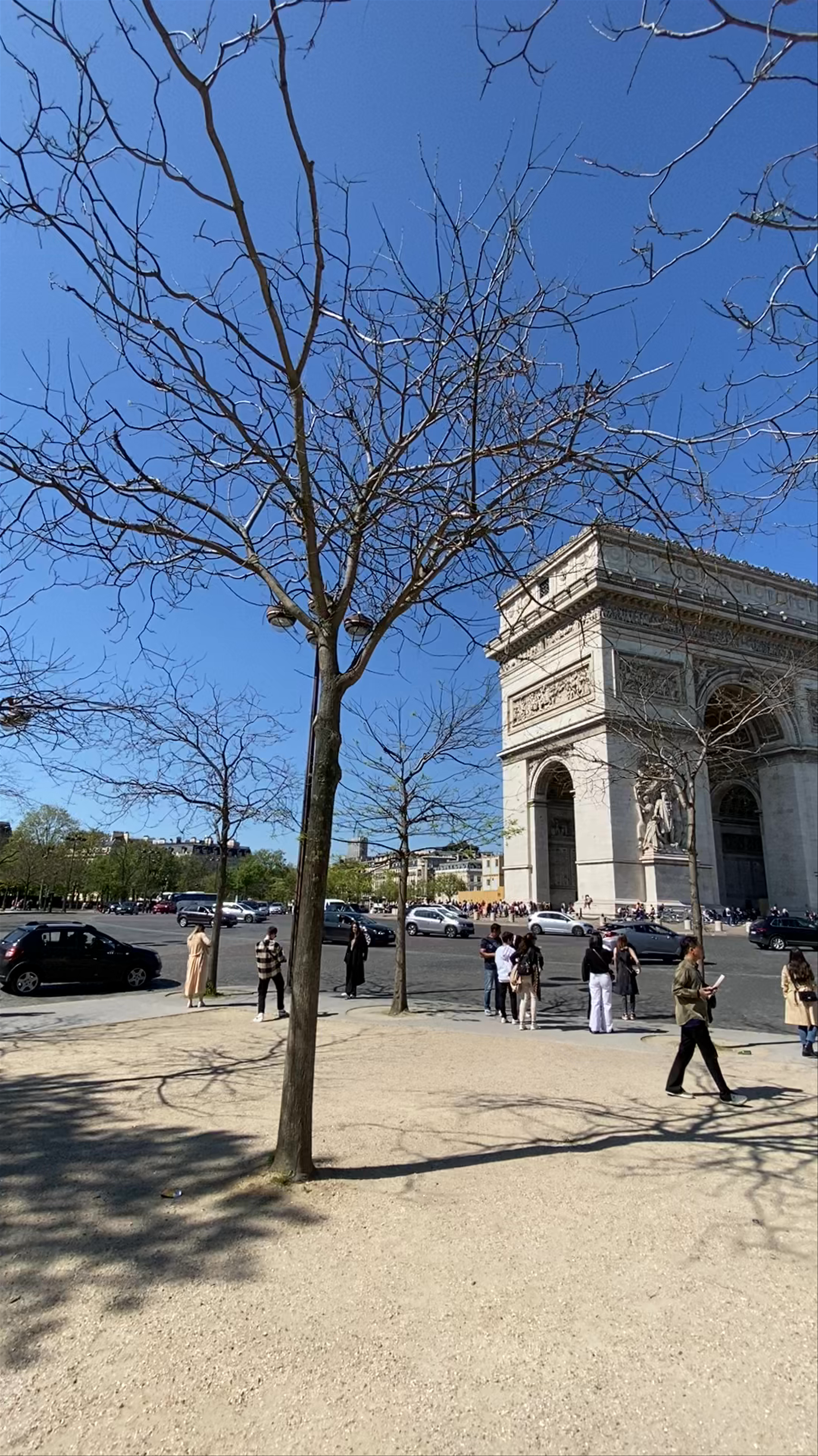 Iconic Views of the Arc de Triomphe in Paris on a Bright Spring Day