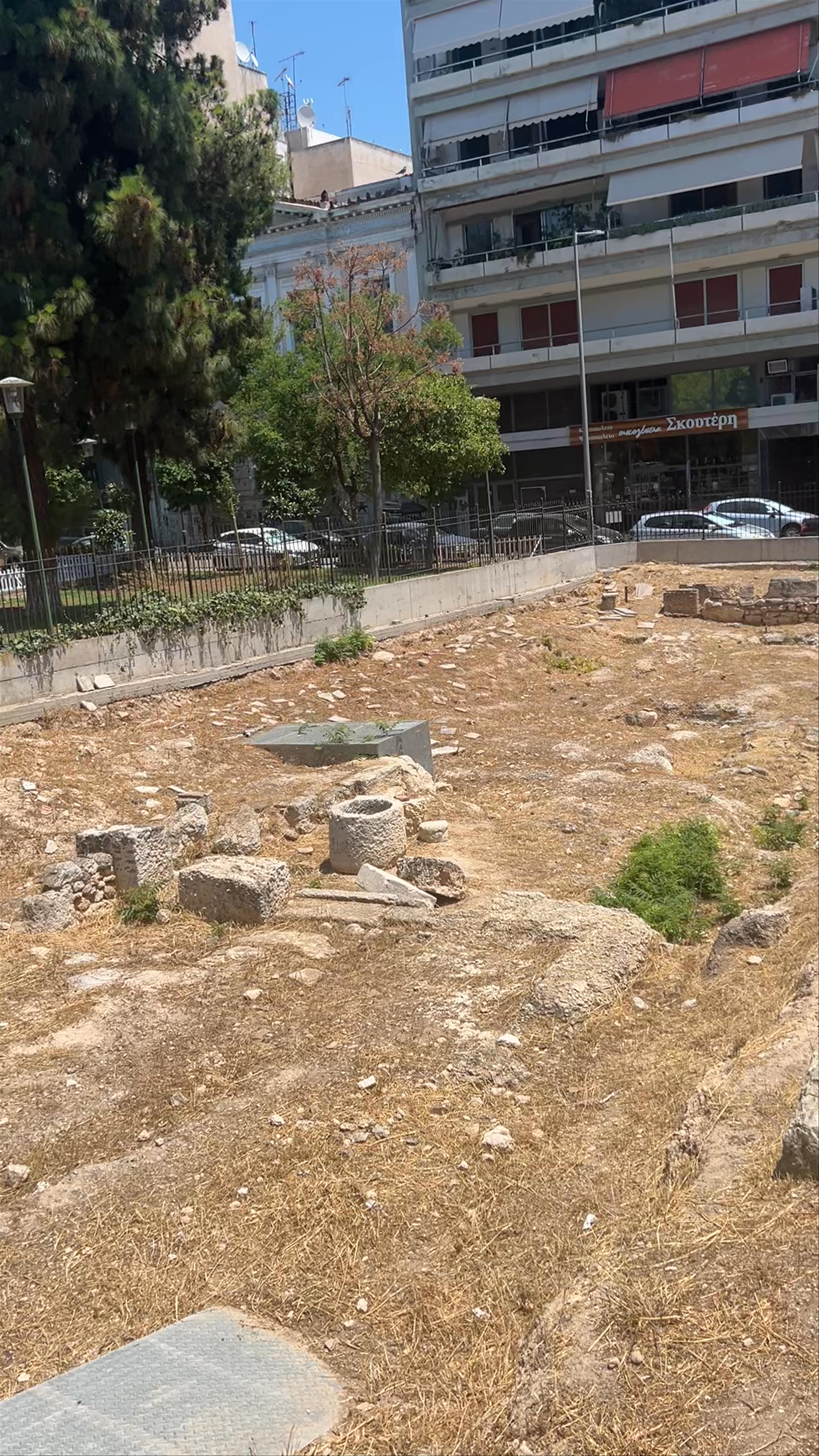 Ancient Ruins of the Pantheon of Piraeus Amid Urban Life