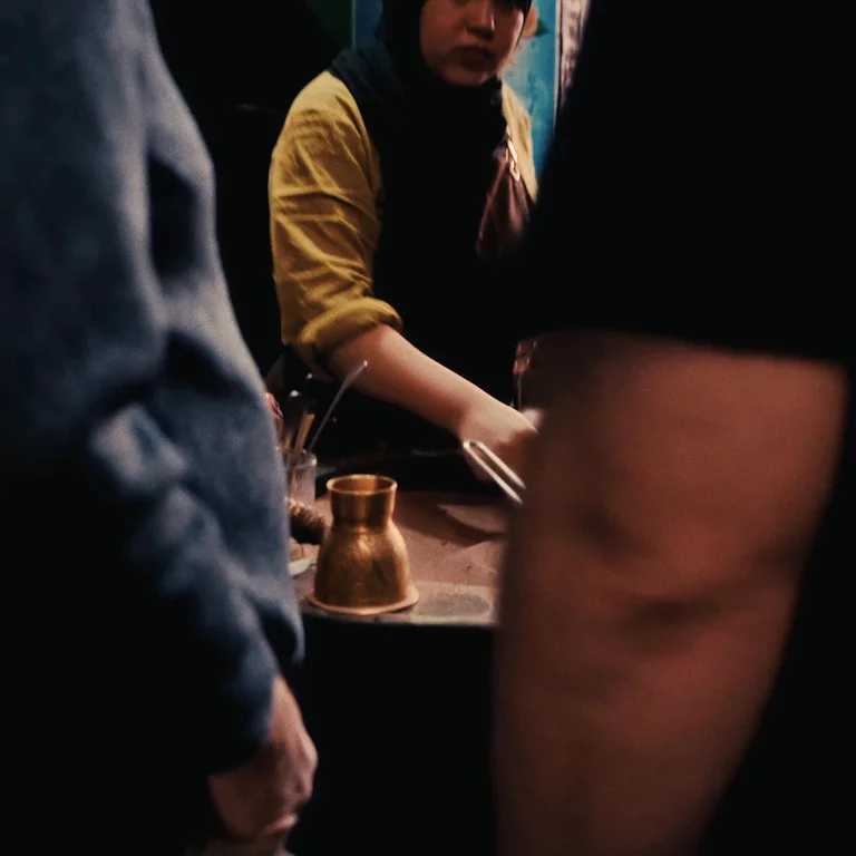 Videof woman making coffee in the traditional Moroccan sand method of brewing