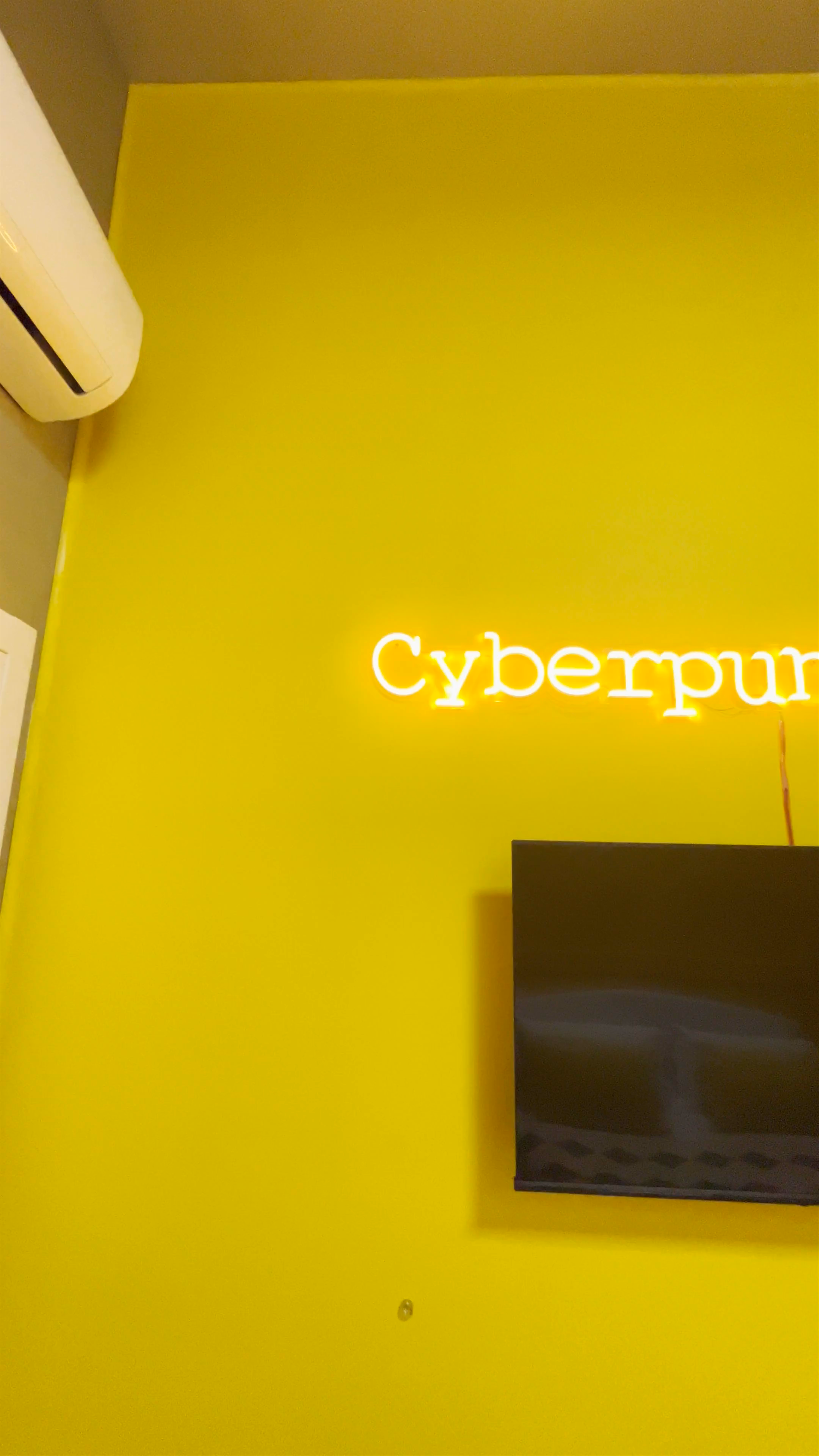 Vibrant Cyberpunk-Themed Room at Moma Rooms, Naples