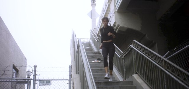 Woman running down steps