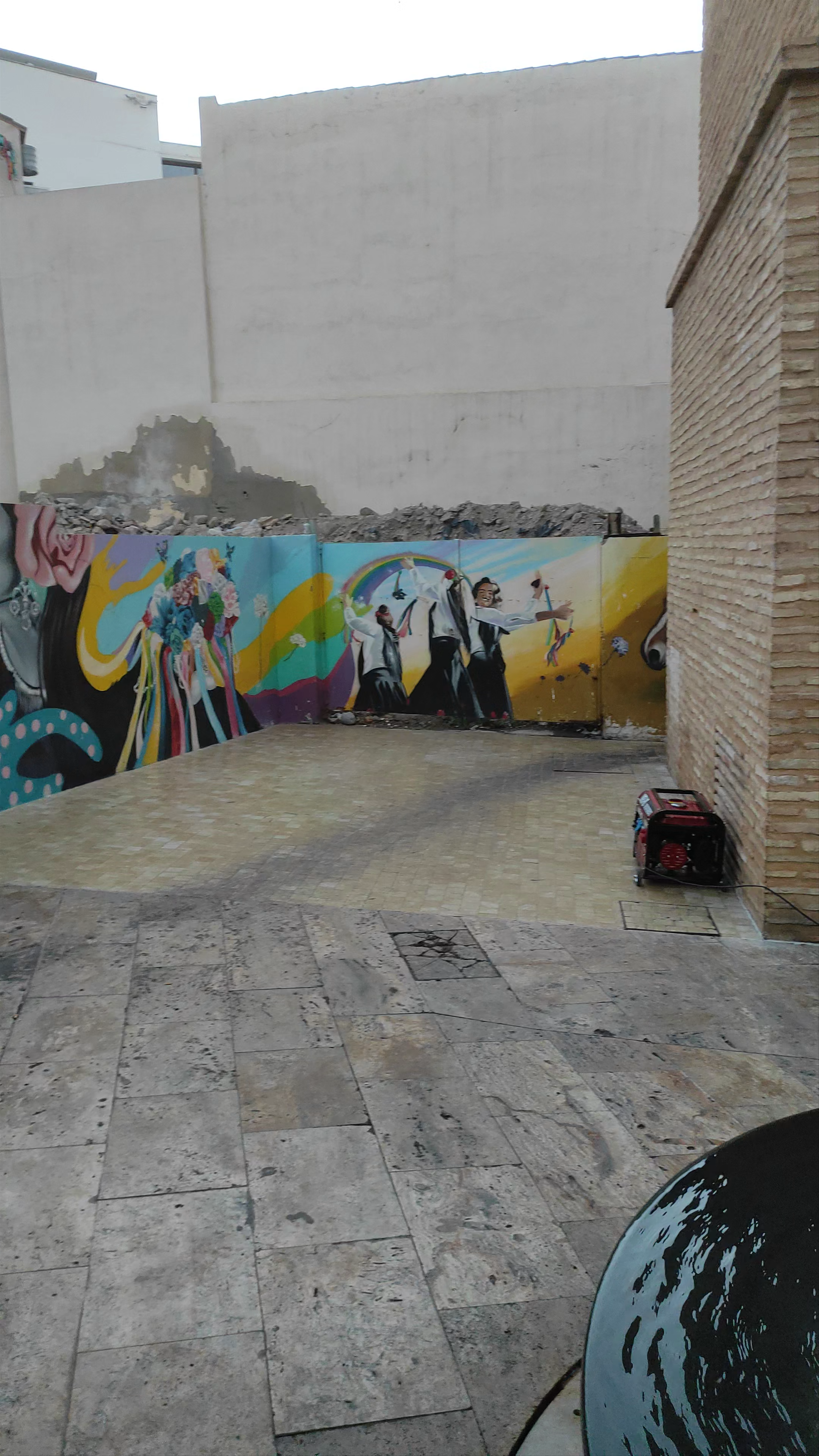 Vibrant Street Art and Urban Ambiance at Plaza de la Judería, Málaga