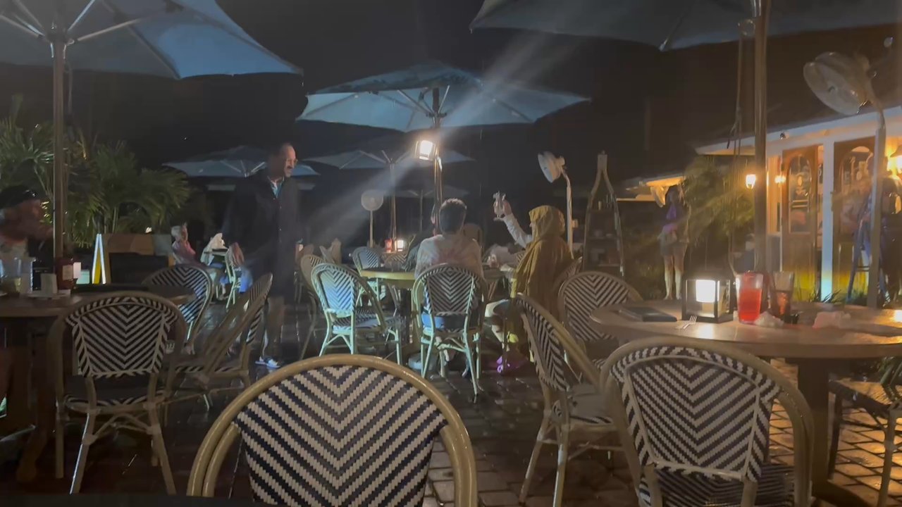 Gramma Dot's - The customers who elected to stay outside whilst the wait staff hid inside from the brief rain storm - Seafood Near Me - Sanibel, Florida