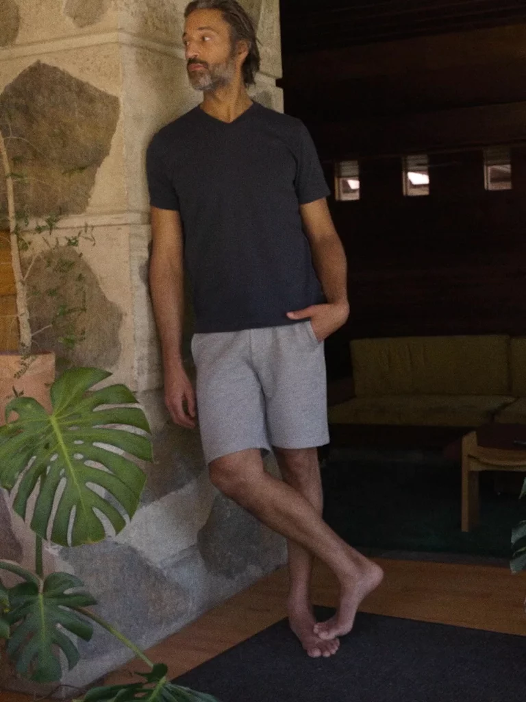 Video of man wearing Relaxed-Fit V-Neck Tee outside of mid-century home