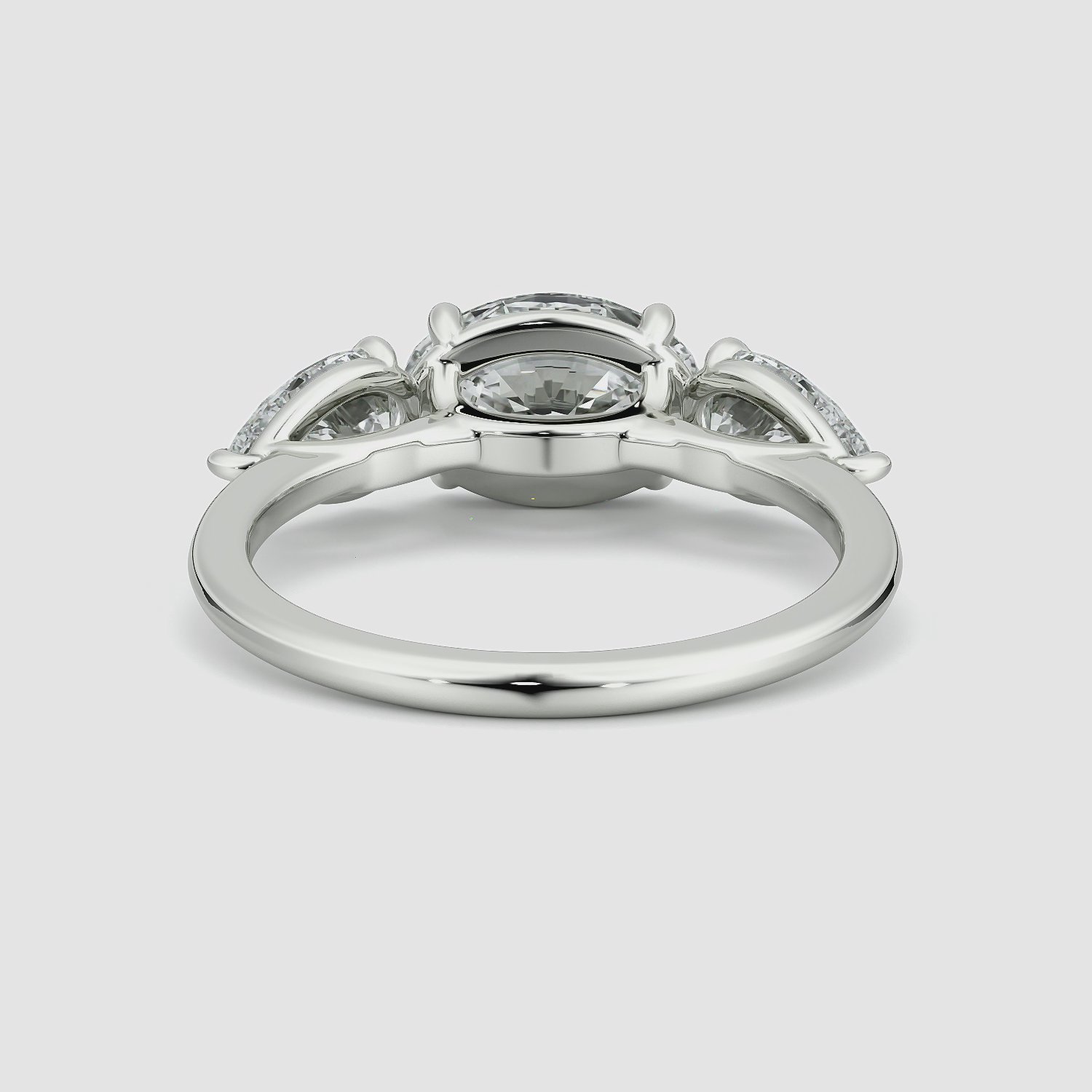 The Three Stone | Oval | 18k | White Gold | bandAccent: Plain | diamondOrientation: horizontal | sideStoneCarat: 0.50ct | sideStoneShape: Pear | caratWeight: other