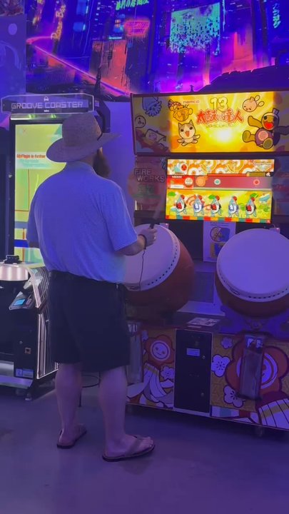 Captain Crazy's Paradise - Playing some drum rhythm-style game. So much fun. - Mini Golf Near Me - Foley, Alabama