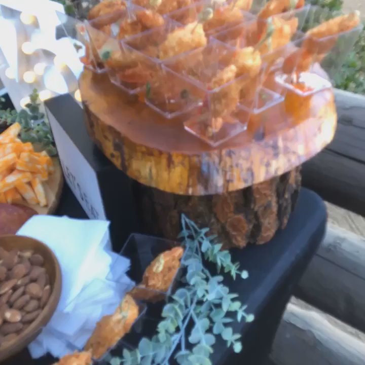 Chef Carlos Catering - Appetizer table: charcuterie, coconut crusted jumbo shrimp with a sweet chili sauce, and a chicken satay with peanut sauce. - Personal Chefs Near Me