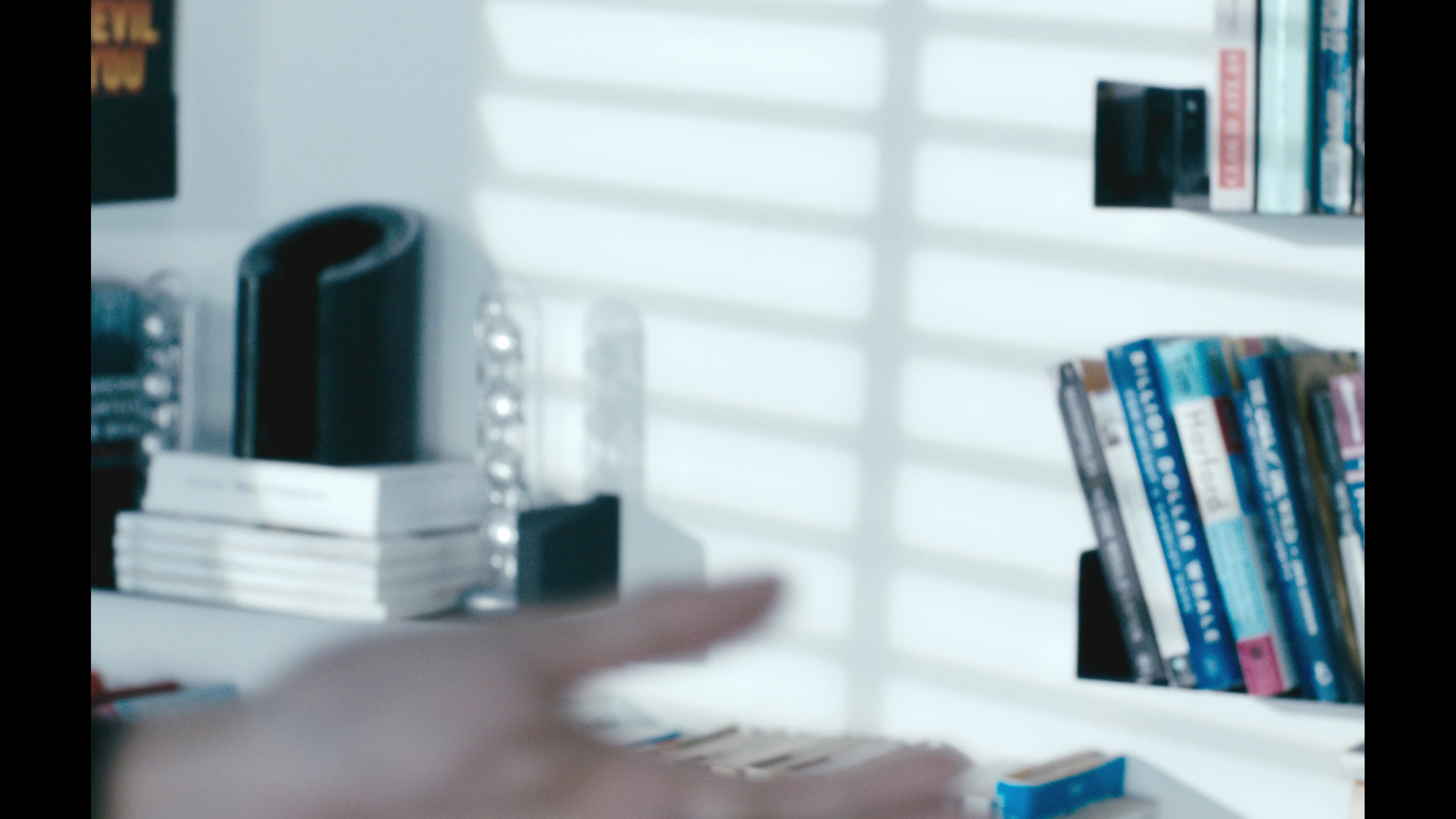 A couple shares an intimate moment before the scene transitions to a man exploring a digital environment while wearing a virtual reality headset. The contrast highlights the shift between physical human connection and immersive technological engagement.