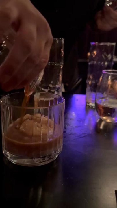 Madame - This is the preparation of the Abrogado pouring the expresso and Brandy over the ice cream - French Near Me - Jersey City, New Jersey