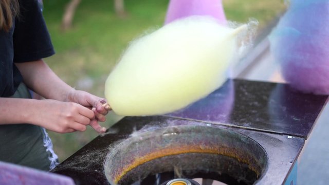Woman making cotton candy 