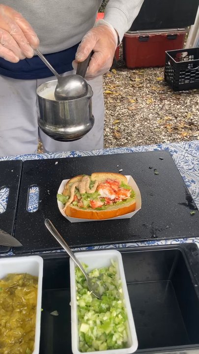 The Barking Claw - Pouring on the fresh hot butter - Hot Dogs Near Me - Falmouth, Massachusetts