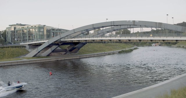 Speed boat under Mindaugas Bridge in Vilnius