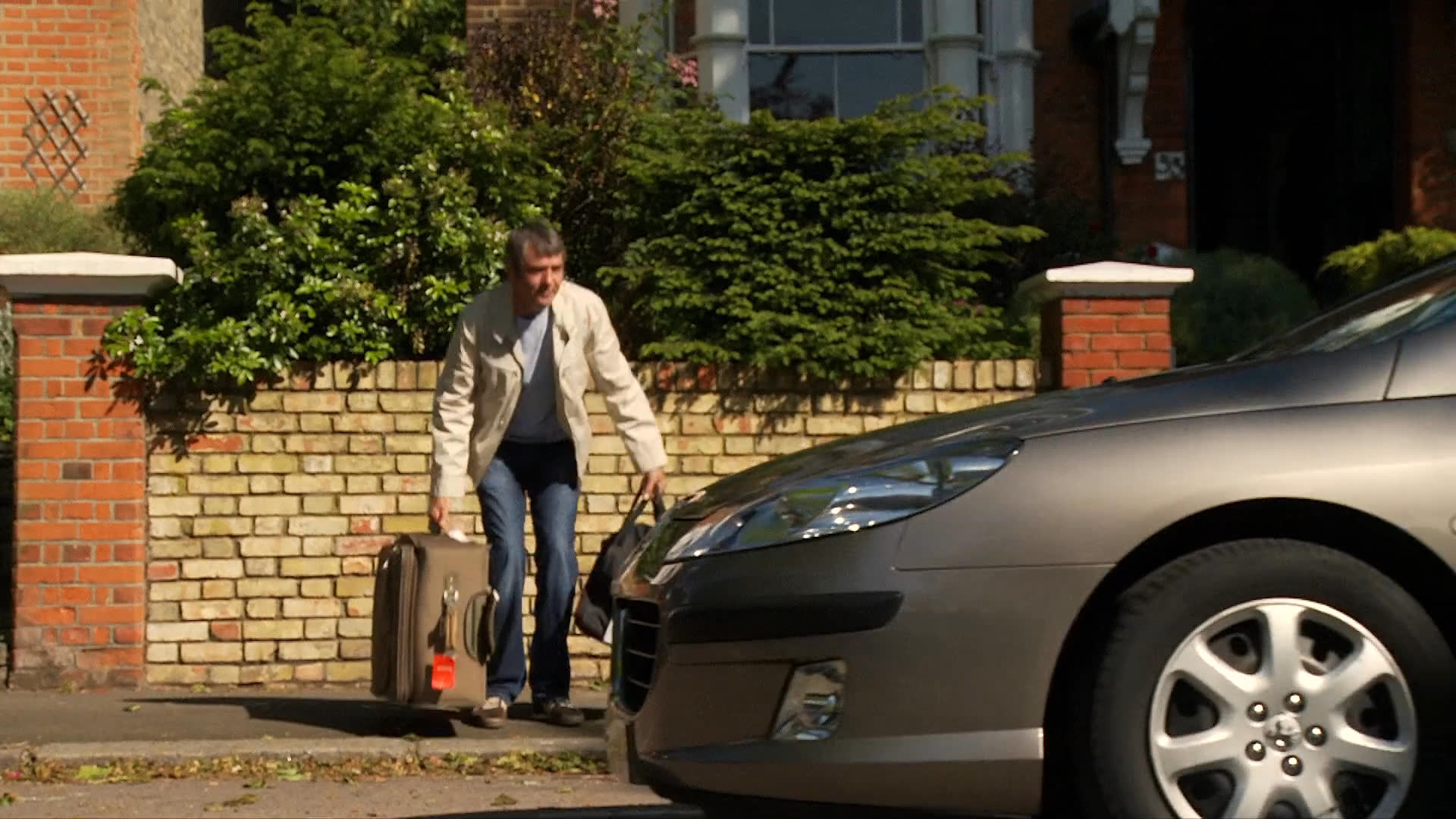 Individuals engage in a serious discussion indoors before departing from a residential home with luggage and driving away. The sequence concludes with a scenic outdoor view featuring San Francisco.