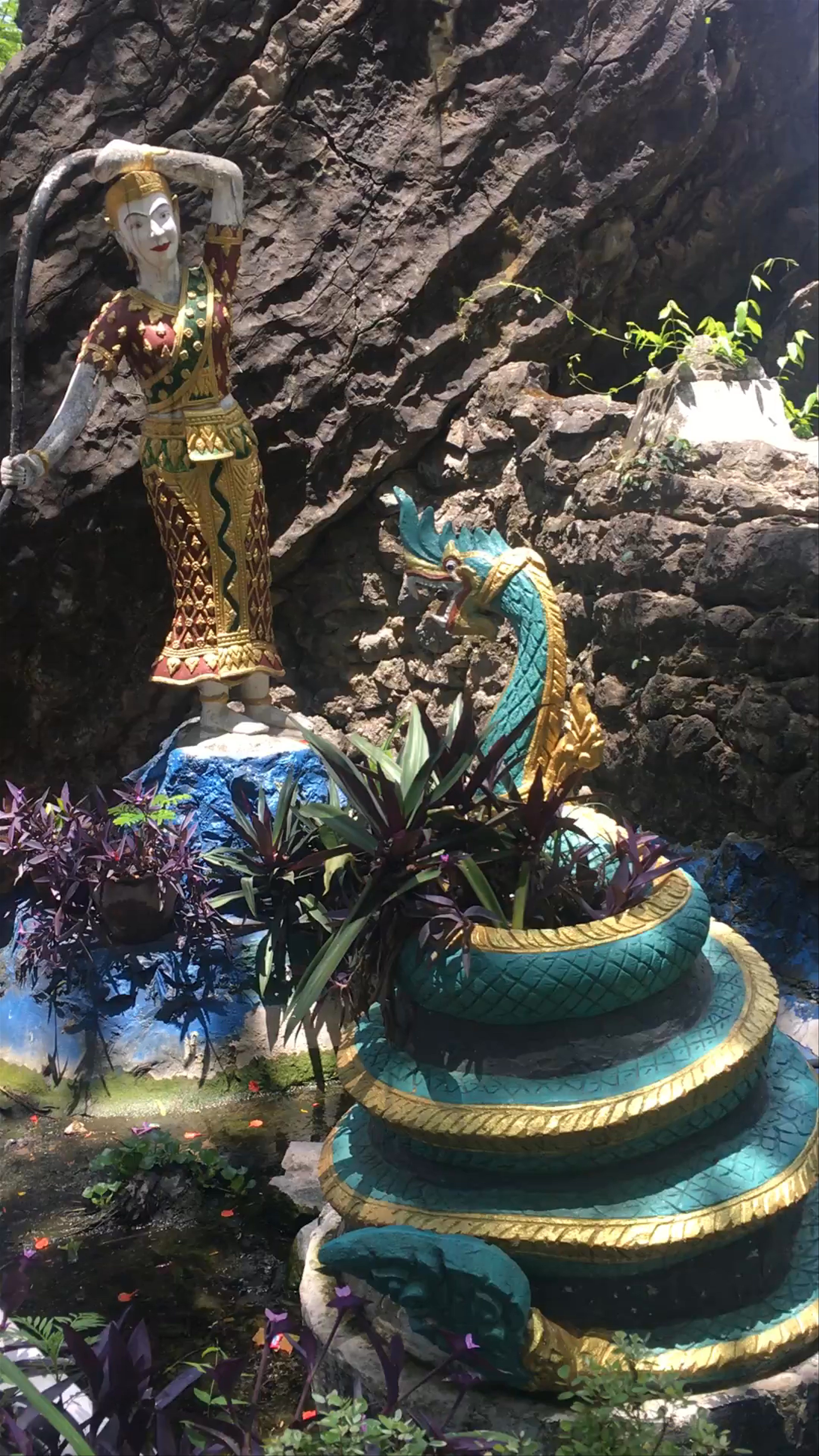 Phousi Hill Serenity: Spiritual Statues & Lush Nature in Luang Prabang