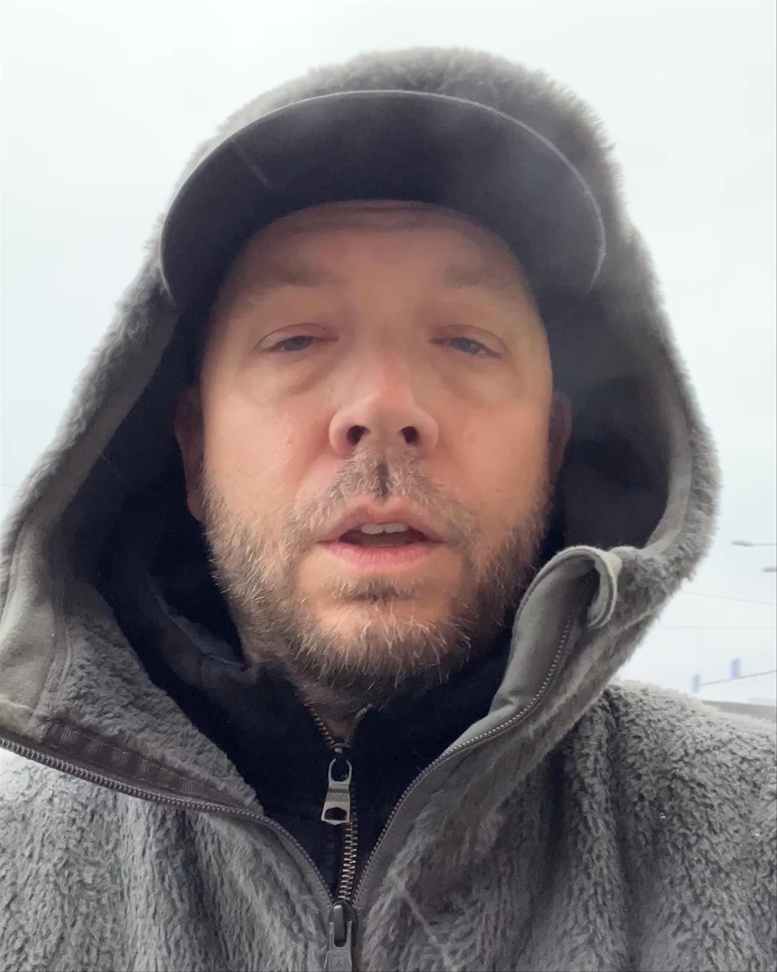 Selfie video of Jason Perry explaining why winter clothes are important