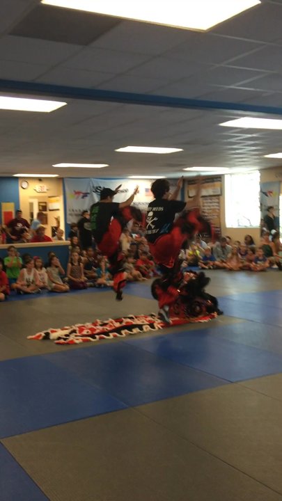 Lakeway TaeKwonDo - Entering the dragon: Dragon dancers bless the new dojang through the traditional auspicious dance, bringing strength and good luck. - Taekwondo Near Me - Austin, Texas