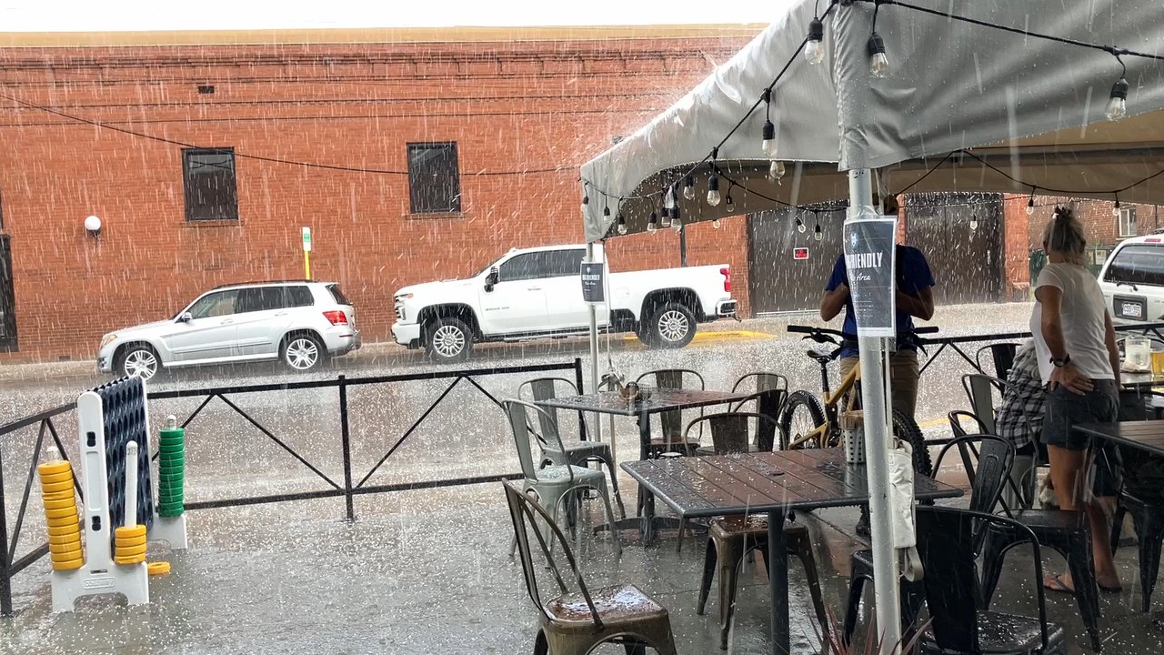 Moonlight Pizza & Brewpub - Heavy brief storm at Moonlight; under canopy - Pizza Near Me - Salida, Colorado