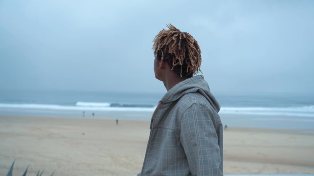 A man walking on the beach