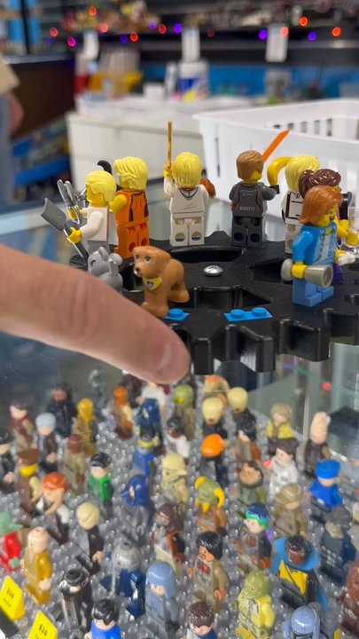 Bricks and Minifigs - The custom minifigs displayed on the wooden gear when in action - Toy Stores Near Me - Oceanside, California
