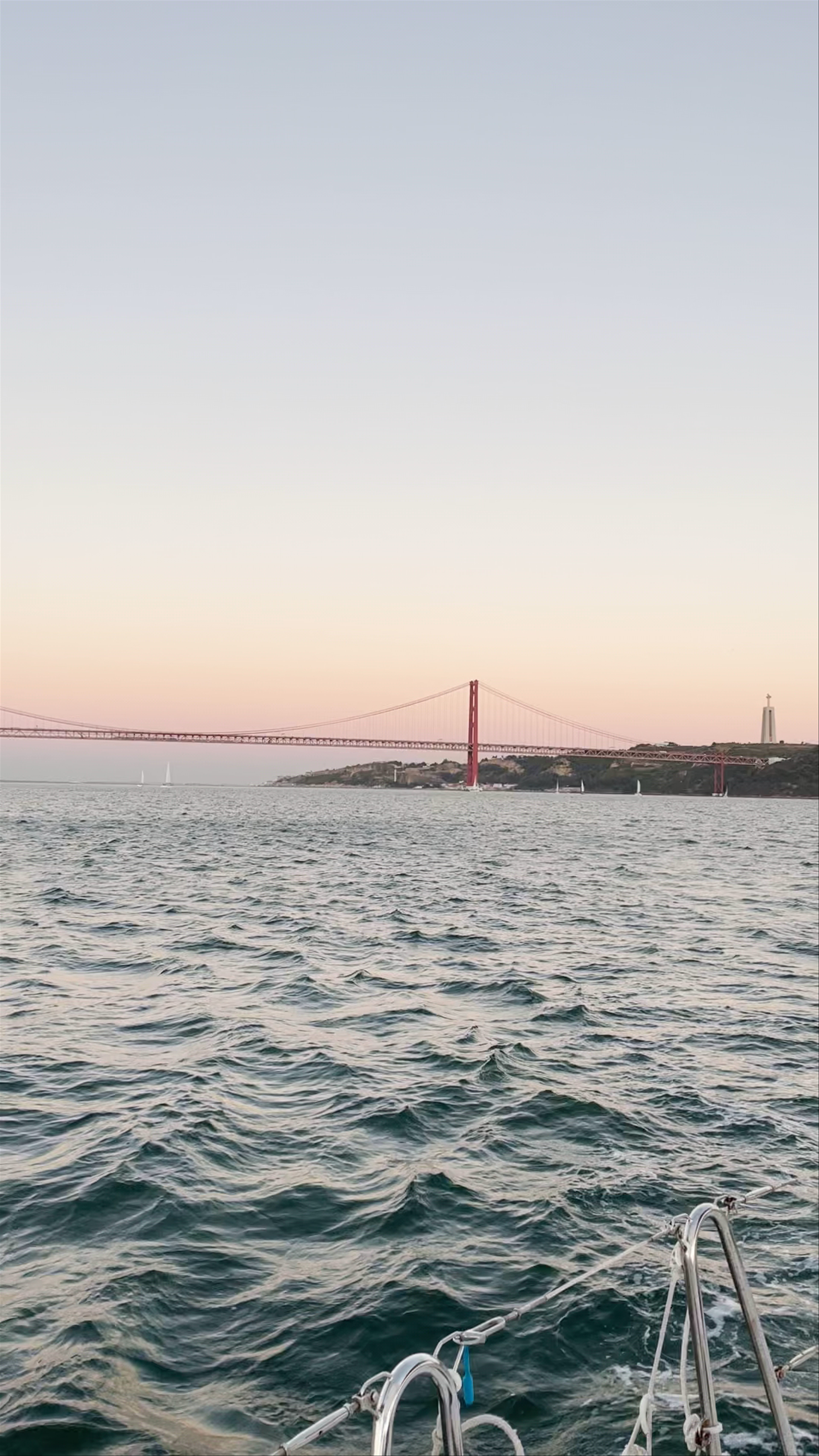 Sunset boat ride near the Pte. 25 de Abril