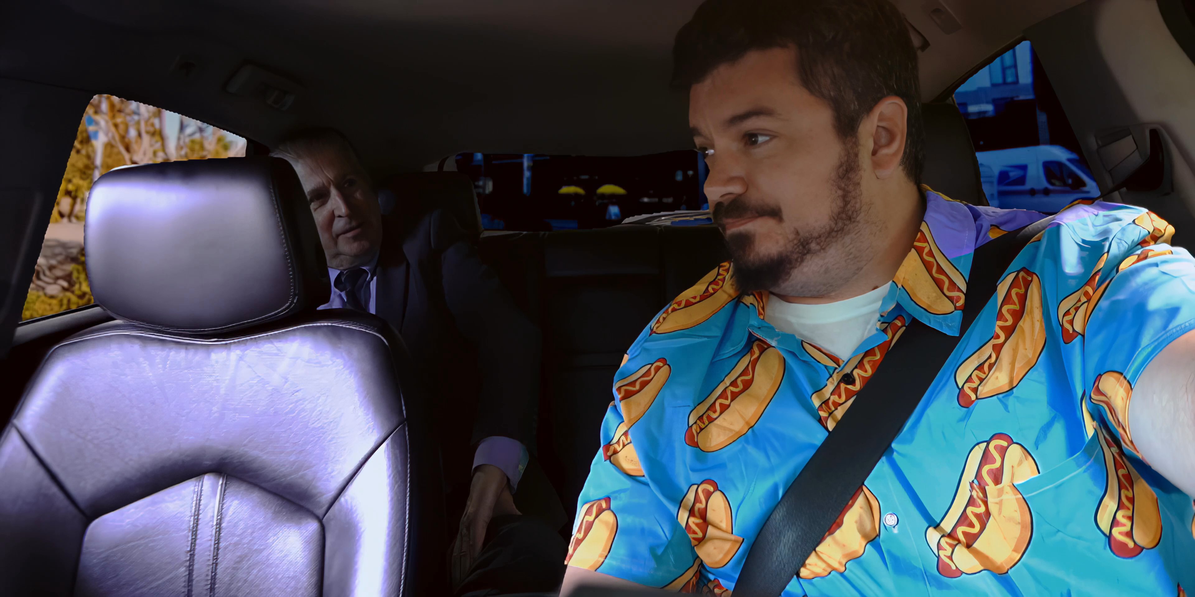 Two men travel in a car before arriving at a commercial establishment. The passenger in a vibrant patterned shirt departs the vehicle and enters a retail space.
