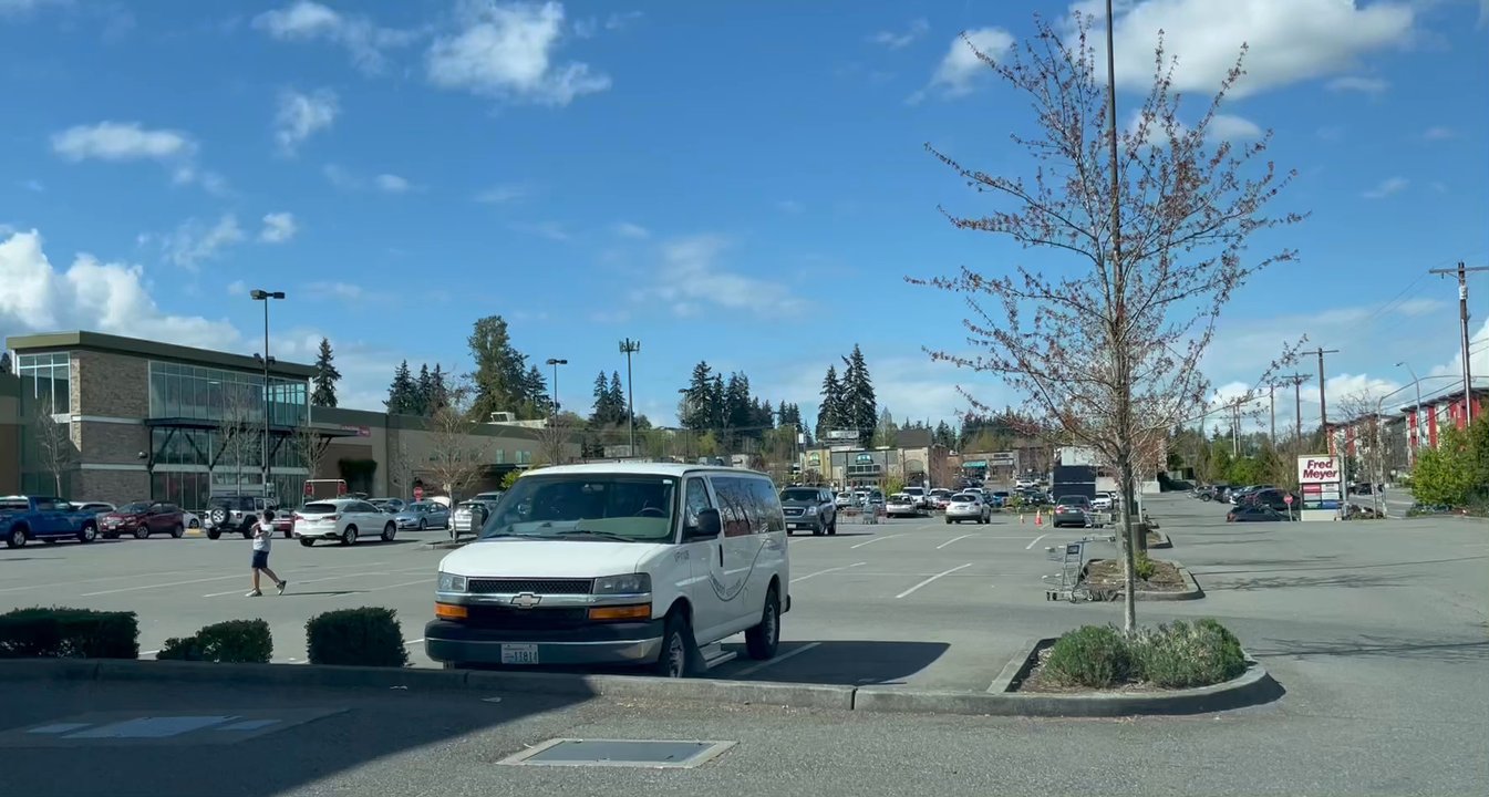 Fred Meyer - Two people illegally playing ball in the parking lot. - Grocery Near Me - Lynnwood, Washington