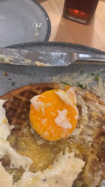 Waffle Stop - An "over easy" egg I ordered. FRIED CHICKEN & EGG BOWL  Disappointed to say the least. - Breakfast & Brunch Near Me - Tacoma, Washington