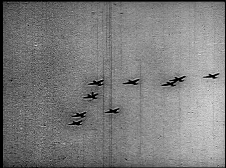 A military veteran recounts his experiences during the attack on Pearl Harbor, illustrated by historical black-and-white footage of fighter planes in flight and subsequent explosions.