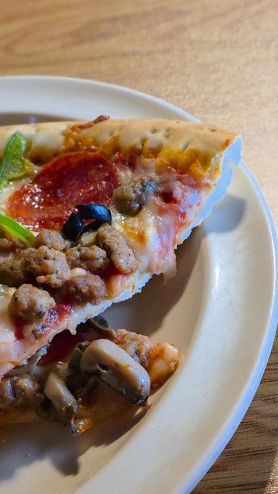 Pizza Den - Close-up of the slices of pizzas on my plate. - Buffets Near Me - Salem, Virginia