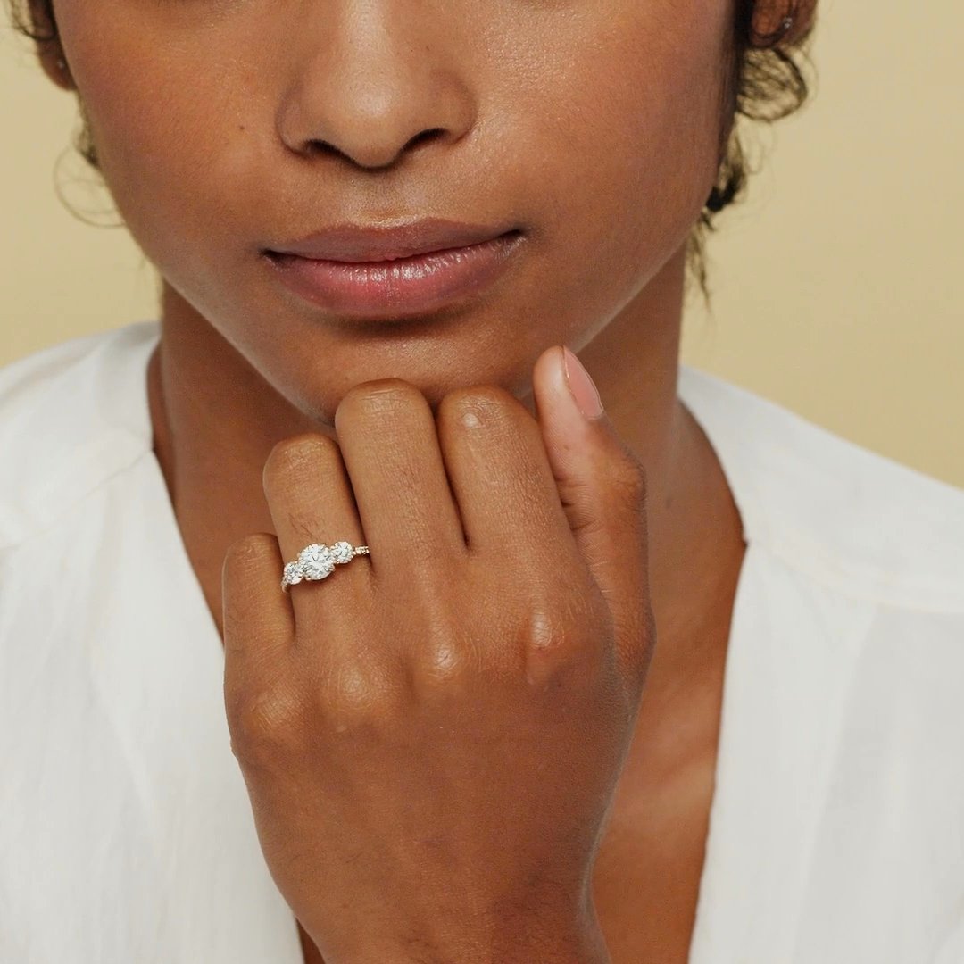 The Three Stone | Round Brilliant | 18k | White Gold | bandAccent: Pavé | caratWeight: other | sideStoneCarat: 0.25ct | sideStoneShape: Round Brilliant | diamondOrientation: vertical