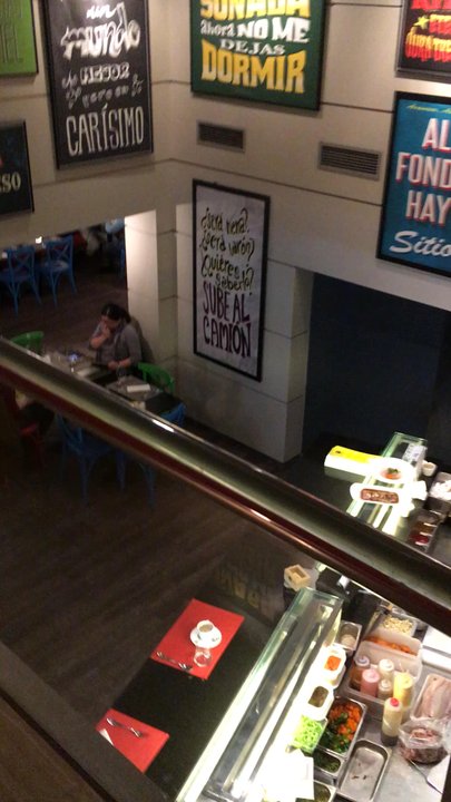 Ceviche 103 - The view from the upper floor, where the bathrooms are, down toward the open kitchen/assembly area and 2nd floor eating area - Peruvian Near Me - Barcelona, B
