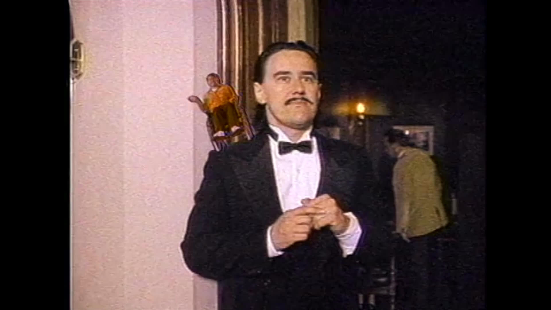 A waiter dressed in a tuxedo experiences surreal visual distortions while working in a restaurant, culminating in a mysterious encounter with a customer in a wheelchair.