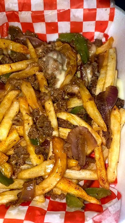 Cesar's Snack Shack - Fries topped with quesadilla cheese, ribeye,chopped sautéed bell peppers and onions - Cheesesteaks Near Me - Duncanville, Texas