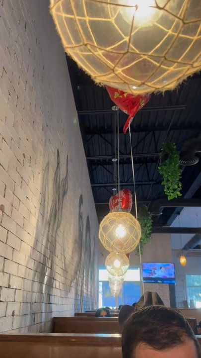 Los Aguachiles - Performer singing - Seafood Near Me - El Paso, Texas