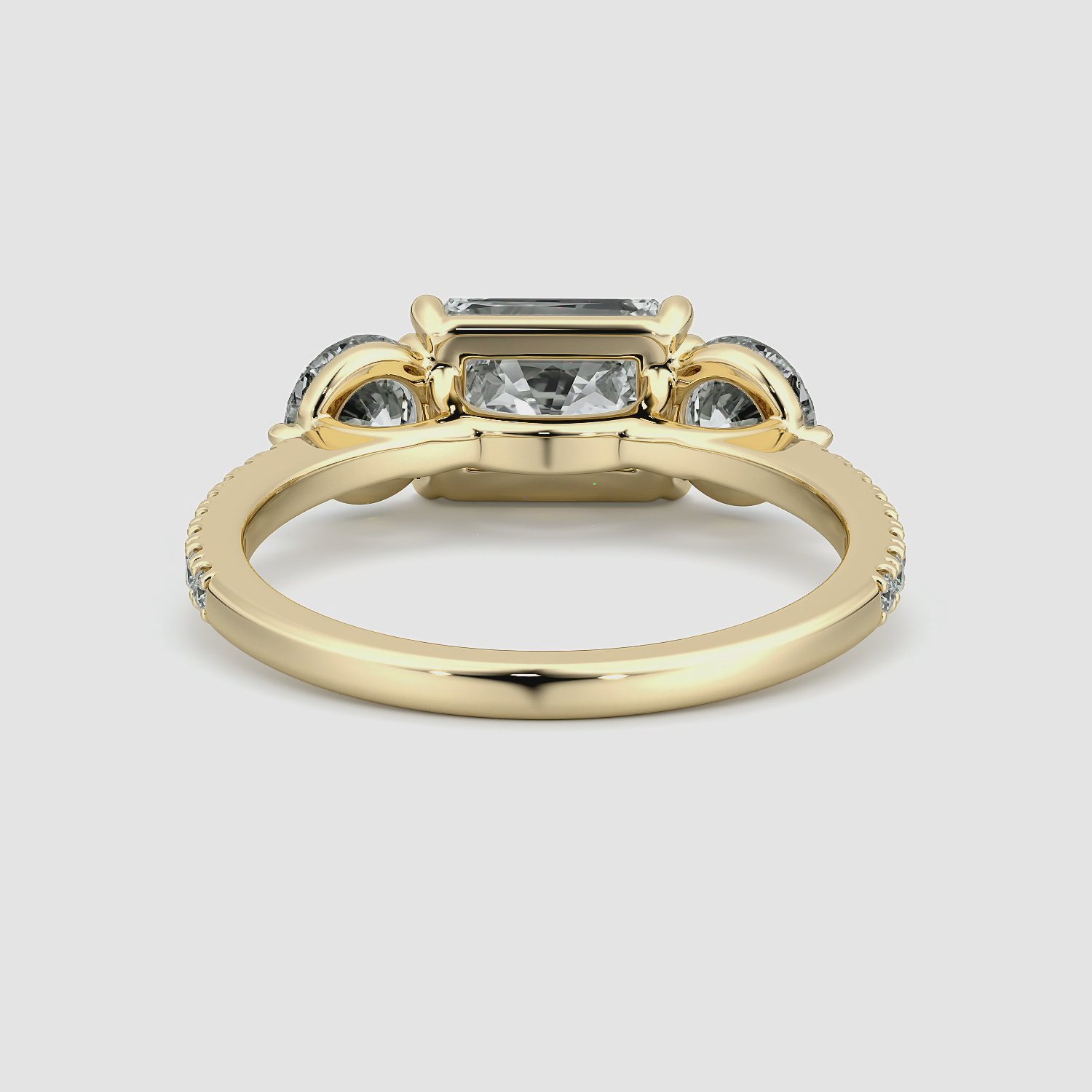 The Three Stone | Radiant | 18k | Yellow Gold | bandAccent: Pavé | diamondOrientation: horizontal | sideStoneCarat: 0.50ct | sideStoneShape: Round Brilliant | caratWeight: other