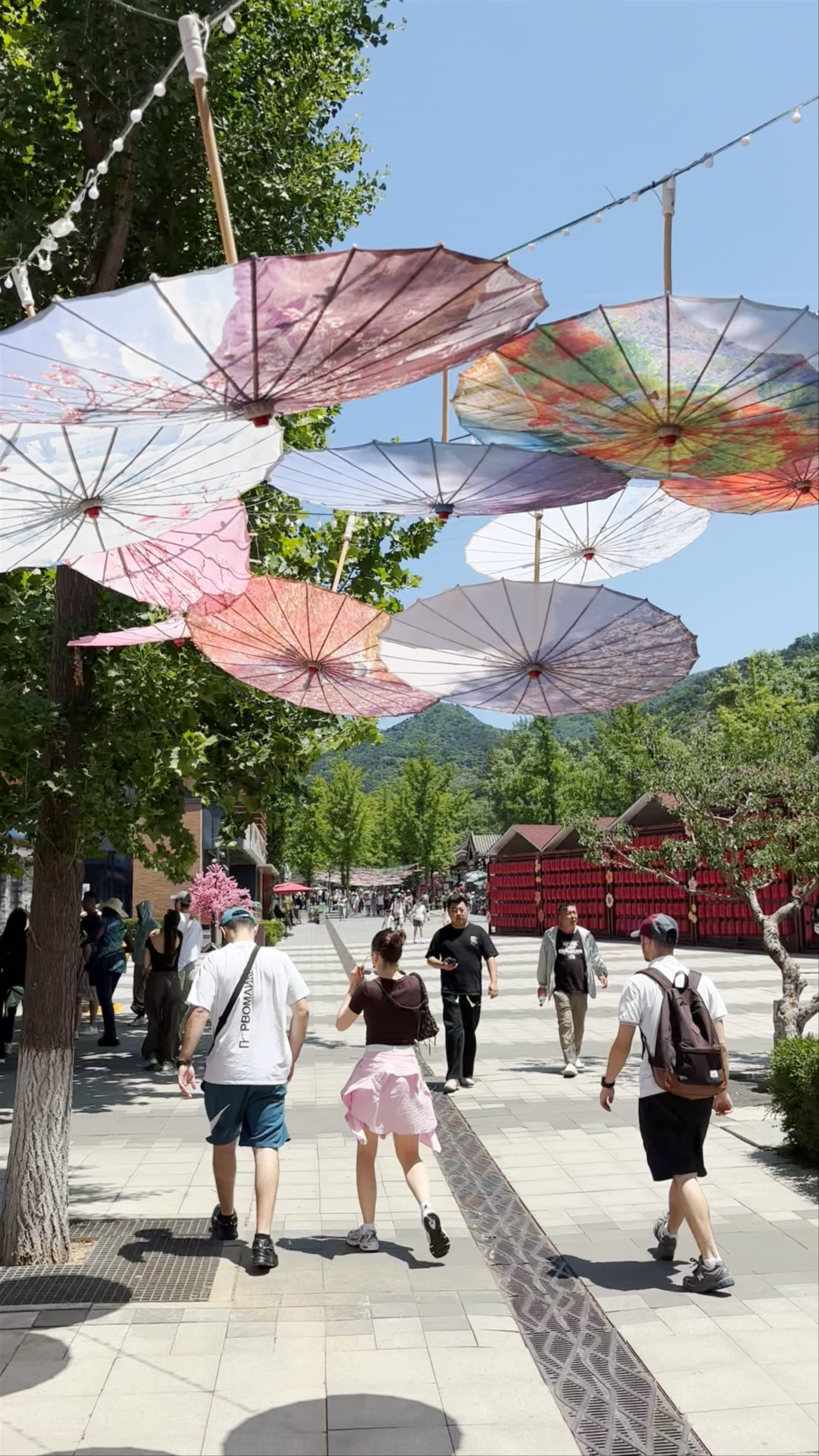 Mutianyu Great Wall: Scenic Entrance and Vibrant Tourist Walkway