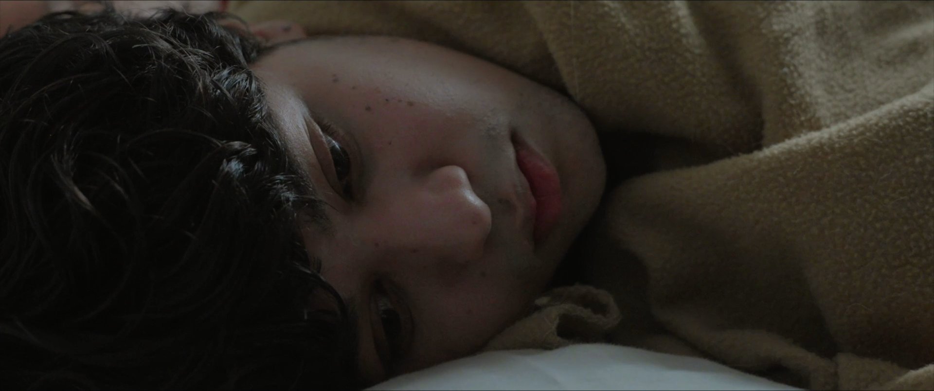 A couple navigates a sequence of intimate kitchen moments followed by a sudden domestic confrontation. The narrative shifts between moments of warm connection and instances of emotional distress.