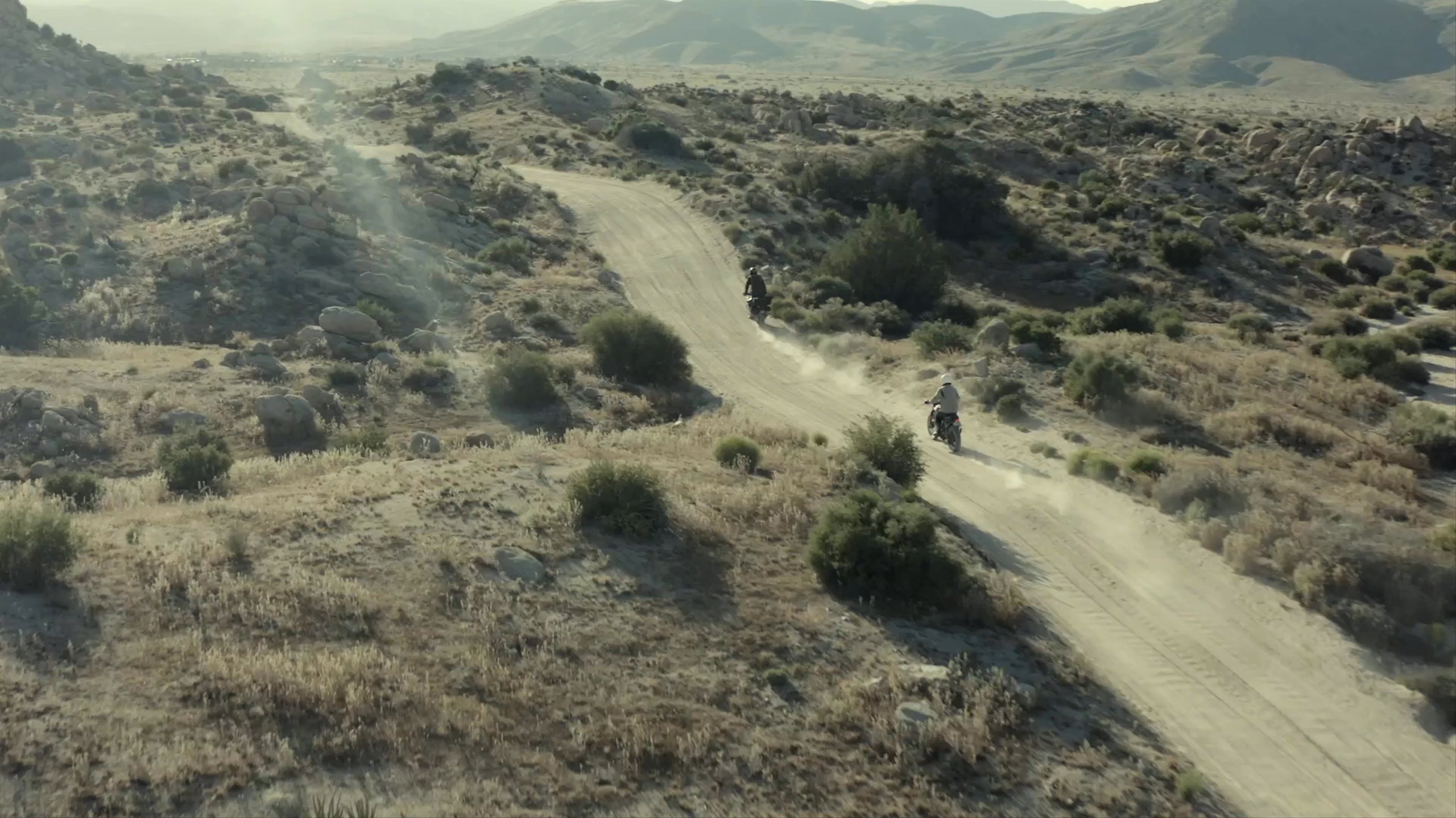 Video of motorcyclists riding down dirt path in Joshua Tree, California