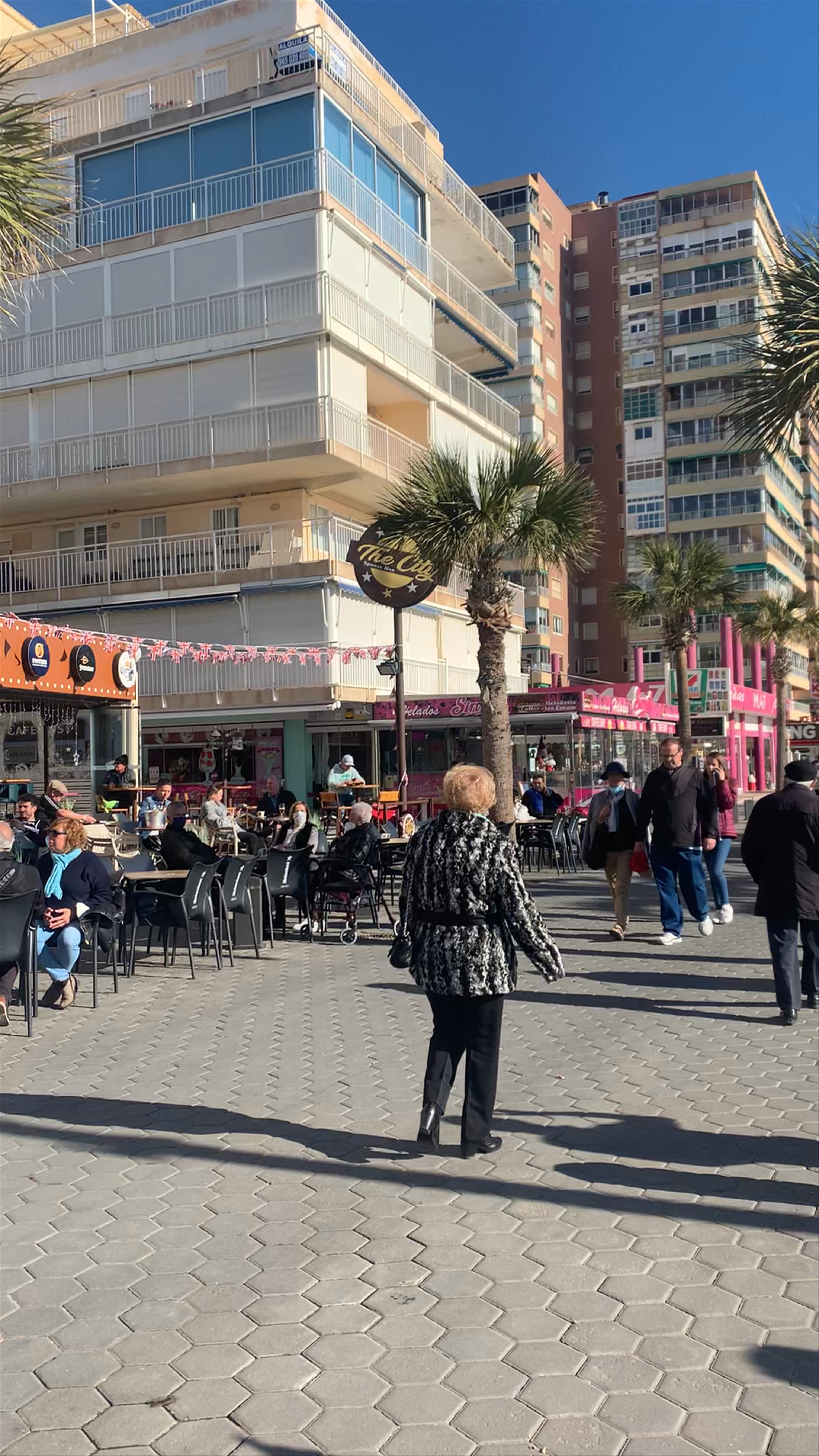 Sunny Beachfront Cafes and Promenade at Platja de Llevant, Barcelona