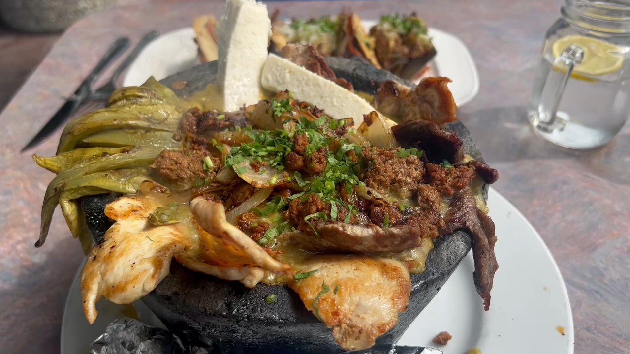 Aki Fresh Mex - A steaming Ali Molcajete served in the traditional stone pot. Delicious! - Mexican Near Me - Marina, California