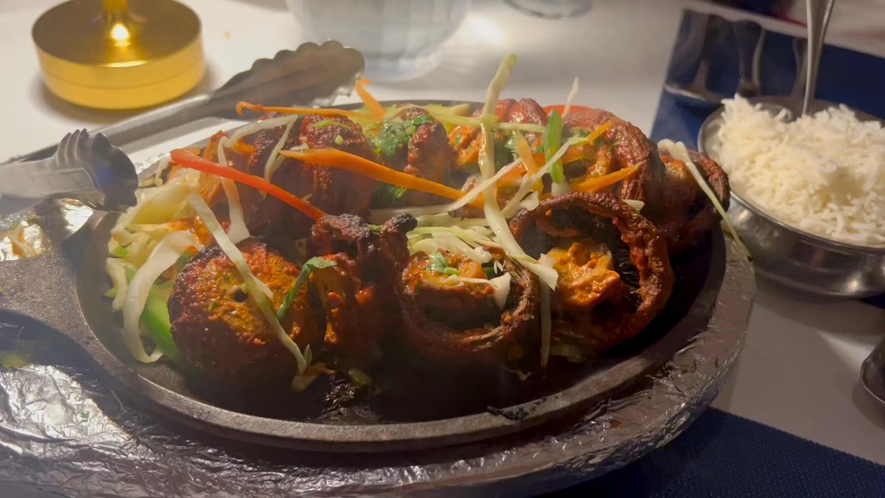 Tandoori Flames - The tandoori mushroom sizzles when it comes to the table! - Indian Near Me - Parsippany, New Jersey