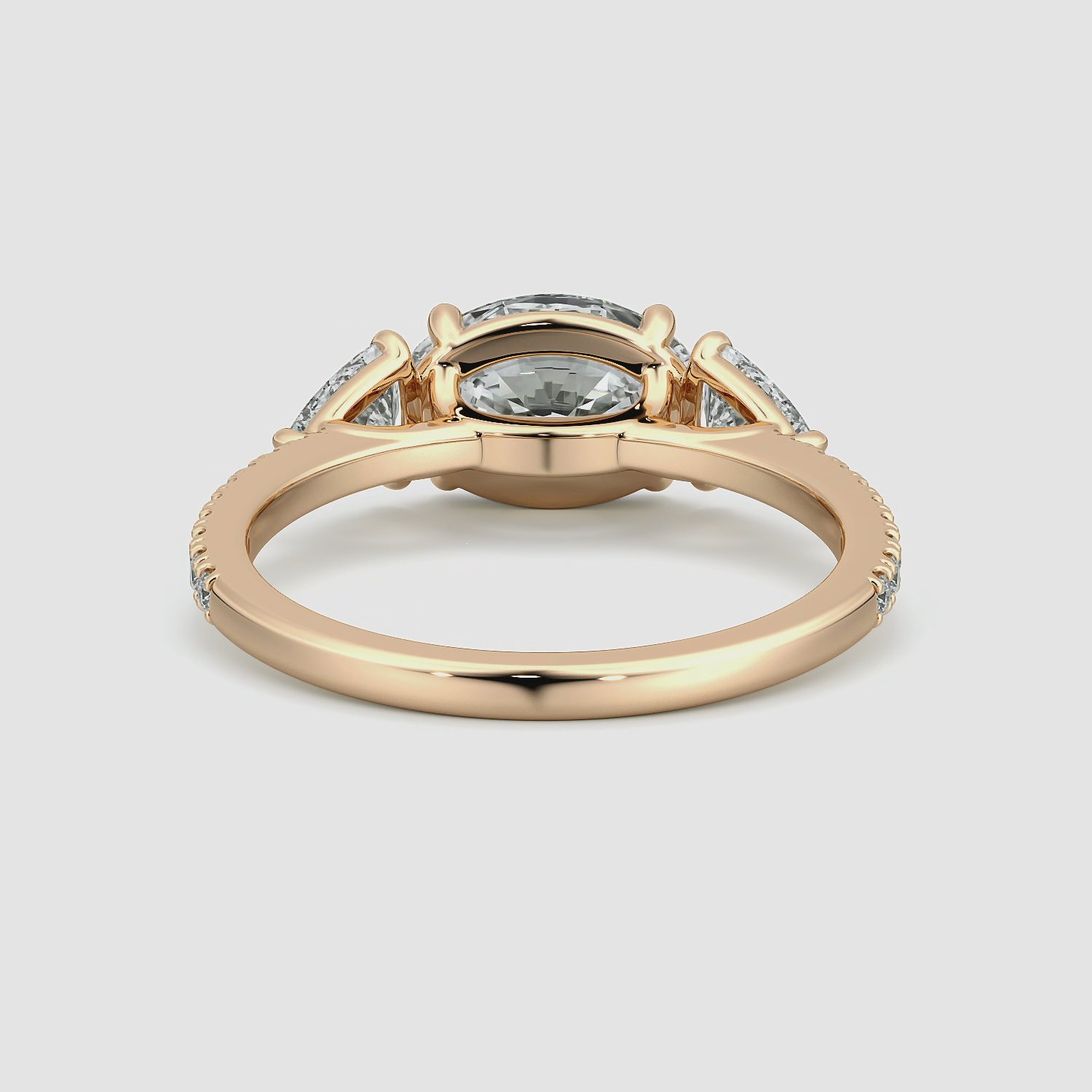 The Three Stone | Oval | 14k | Rose Gold | bandAccent: Pavé | diamondOrientation: horizontal | sideStoneCarat: 0.25ct | sideStoneShape: Trillion | caratWeight: other