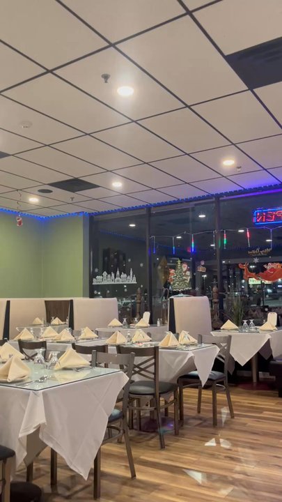 Dosa Grill - View of table settings for large and small tables from my booth area very nice pleasant decor - Indian Near Me - Vestal, New York