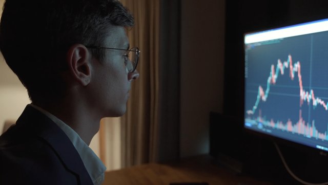 A man shutting down his PC after working on it