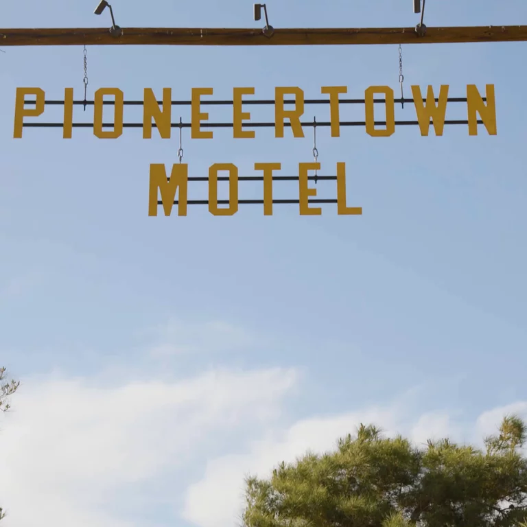 Pioneertown Motel sign blowing in the wind