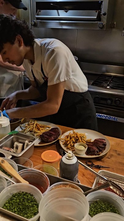 Canard - Absolute artists at work, plating steak and duck frites!  We were so lucky to have a front seat to this show! - Wine Bars Near Me - Portland, Oregon