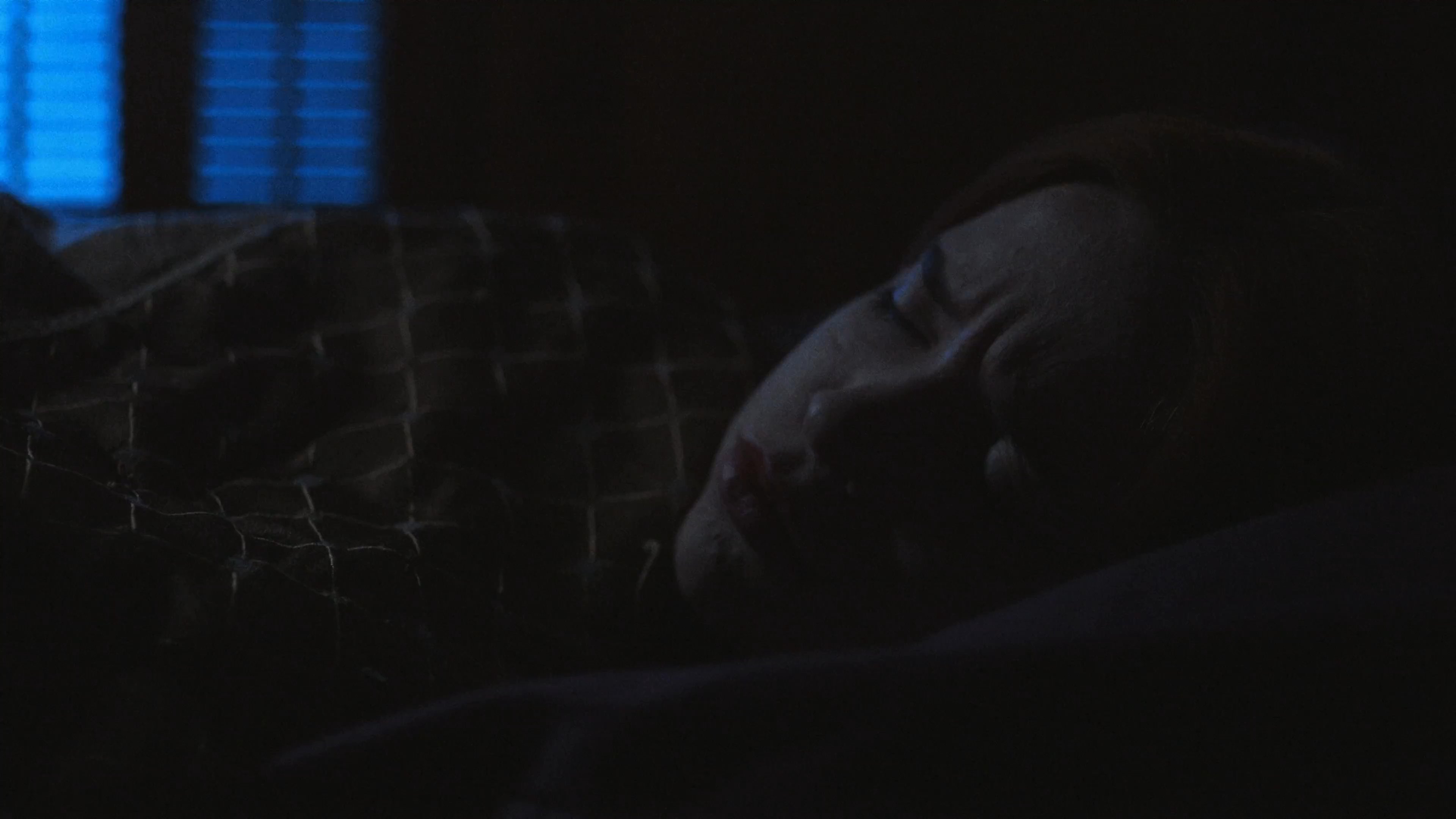 A woman discovers a rotting, bleeding apple in an outdoor setting before transitioning into a troubled sleep and a haunting, fog-filled dream sequence.