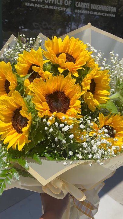 Rogers Flower Shop - Skipping with my weekly bouquet of sunflowers. - Florists Near Me - Ontario, California